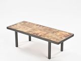 a wooden table with metal legs and a wooden table top