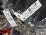 a pile of clothes that is wrapped in plastic bags