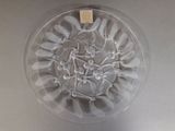 a picture of a glass bowl with spoons and forks in it