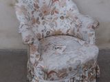 a chair that is sitting in front of a wall