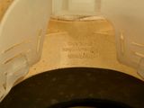 a close up of a toilet seat with the lid down
