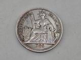 a close up of a silver coin with a statue of liberty on it
