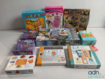 many children ' s books and games on the table
