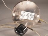 a metal object with a cord attached to it