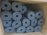 several rolls of blue toilet paper in a cardboard box