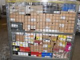 a metal cart with many boxes on it in a warehouse