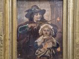 tableau représentant un homme et un enfant tenant un chien, dans un cadre doré