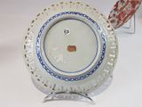 a white plate with a blue and white design on it