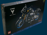 a black box with a black motorcycle inside of it