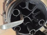 a knife stuck in a bucket of wine on a table
