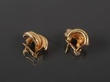 a pair of 18k gold earrings