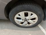 a close up of a car ' s tire on the pavement