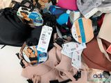 a pile of assorted bras and underwear on a table