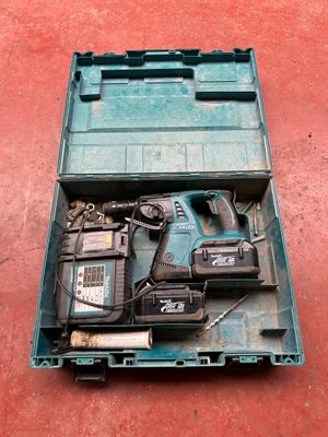 a tool box with tools in it on a red surface