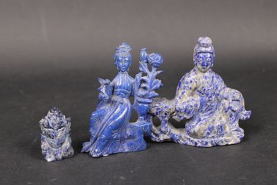 three figurines that are sitting on a table