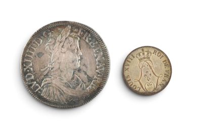 a close up of a coin and a coin on a white surface
