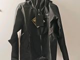jacket hanging on a hanger on a wall in a room