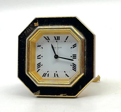 CARTIER Paris. Pendulette de voyage octogonale en métal doré…