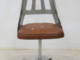 an image of a chair with a brown leather seat