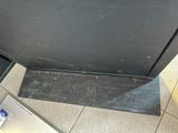a tv that is sitting on the floor next to a box