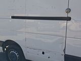 a white van that is parked on the side of the road