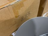 a box and a bucket sitting next to each other on the floor