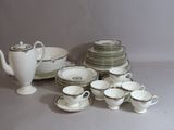 a lot of dishes and cups on the table