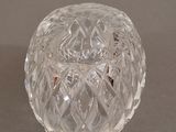a clear glass jar with a lid on a table