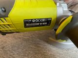 a yellow and black electric polisher on a wooden table