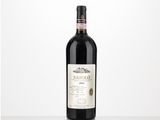 the bottle of red wine is sitting on the table