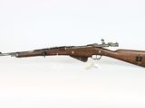 a rifle with a wooden barrel on a white background