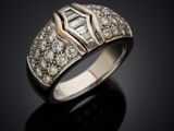 a white gold ring with diamonds and a baguet