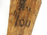 an old wooden coffin with a cross carved into it