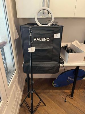 a camera on a tripod in the corner of a room
