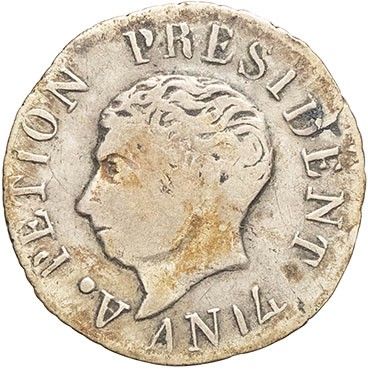 a silver coin with the head of a man in profile