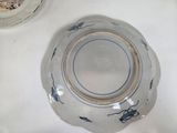 a bowl and a plate sitting on a table