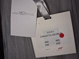a label on a piece of clothing that is attached to a hanger