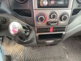 a picture of a car dashboard with a cup holder in it