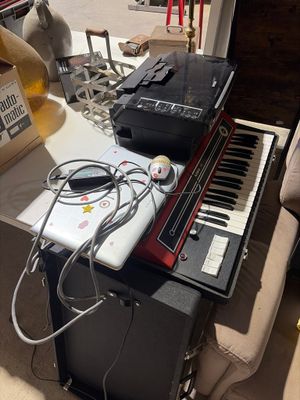 a keyboard and a laptop on a table in a room
