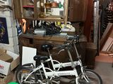 a bike that is sitting in a room with other items