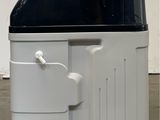 an image of a black and white refrigerator in a room