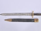 two different types of knives on a white surface