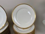 many plates stacked on top of each other on a table