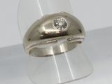 a close up of a ring with a diamond on it