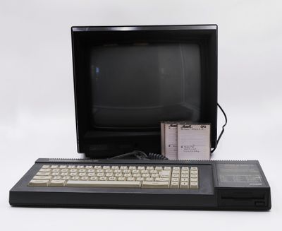 a computer with a keyboard and a monitor on a table