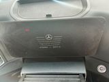 a picture of a car dashboard with a mercedes logo on it
