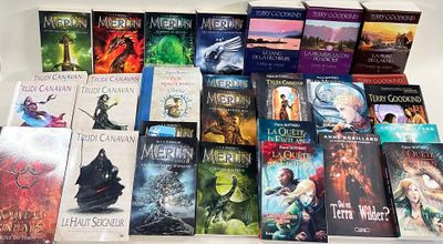 a lot of books that are sitting on a table