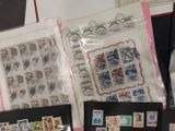 a lot of stamps on a table with a picture on it