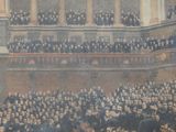 a large group of people sitting in a large room