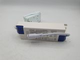 a white and blue box with a white cord attached to it